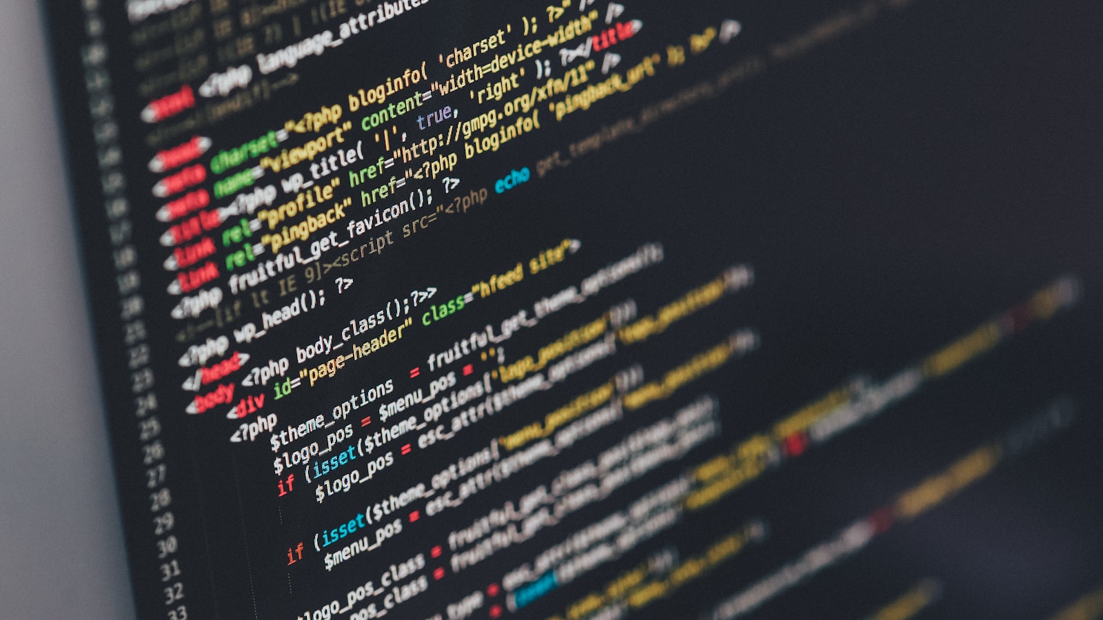 Developer working at monitor with code
